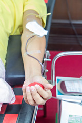 Blood Donor Making Donation with a bouncy ball holding in hand