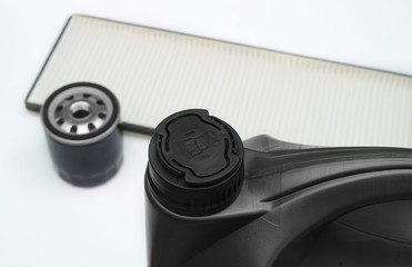 oil filter, oil and automotive cabin filter on a white background