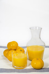 Glass jar with natural orange juice freshly squeezed © Alonso Aguilar