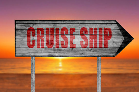Red Cruise Ship wooden sign with on a beach background