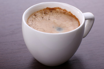 Cup of coffee on table close up