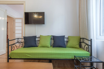 Fototapeta premium Green sofa in modern apartment