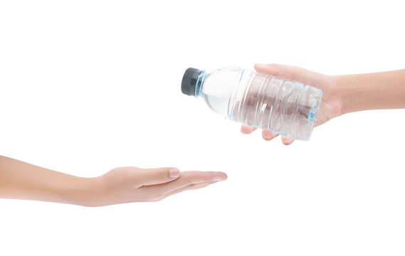 Hands and bottle of water on white background