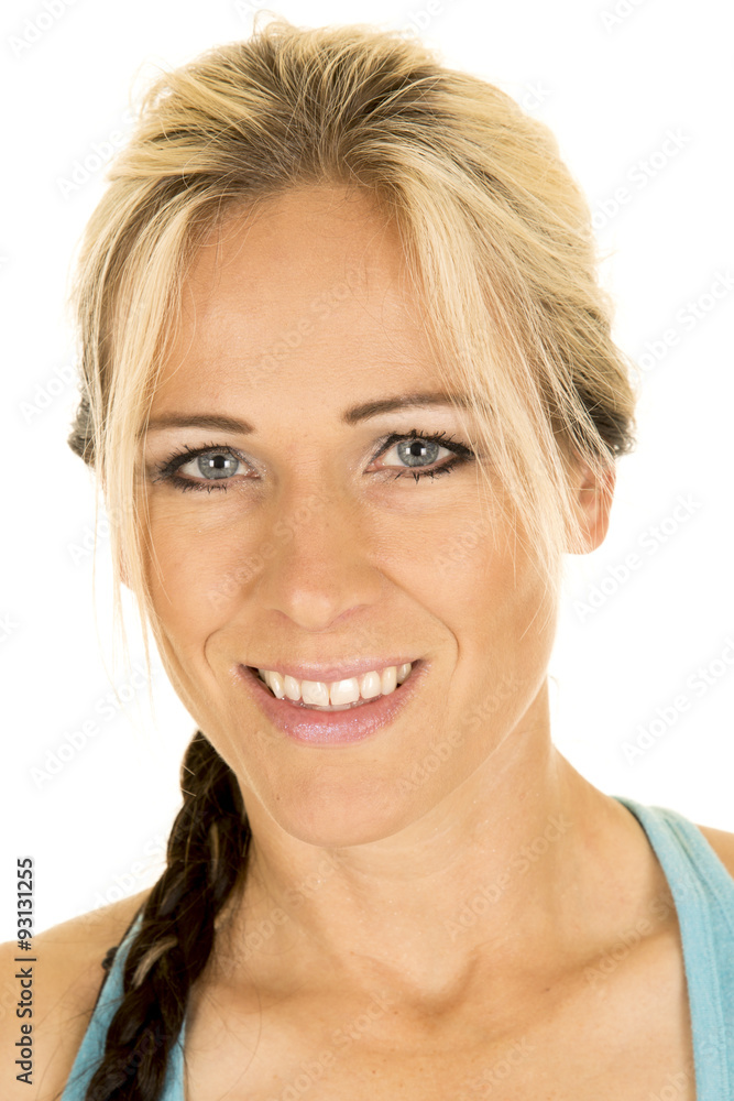 Wall mural woman in blue fitness tank top head shot smile