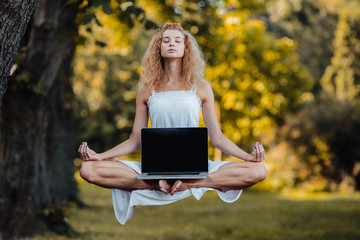 girl levitates with laptop