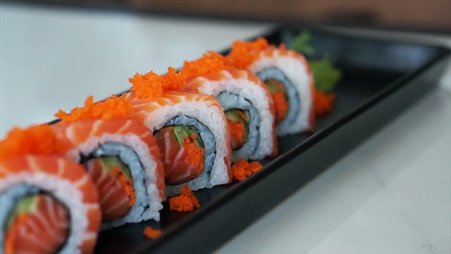 Video of salmon maki roll. Japanese sushi cuisine with fresh raw fish