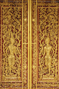 Ancient golden wooden door of Thai temple,Thailand