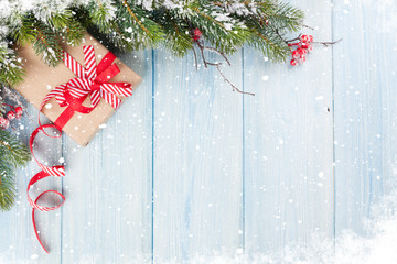 Christmas background with fir tree and gift box