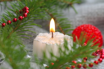 Obraz na płótnie Canvas Snow candle with christmas decoration