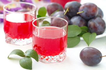 Plum juice and fresh plums