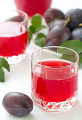 Plum juice and fresh plums