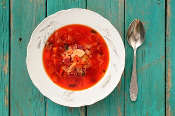 Portion of homemade Russian red beet soup borsch with cabbage an