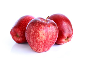 Fresh three red apples isolated on white background.