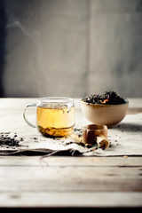 Green tea in a glass cup with steam