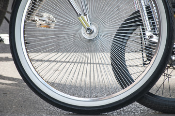 Two bicycle front wheels with spokes closeup 