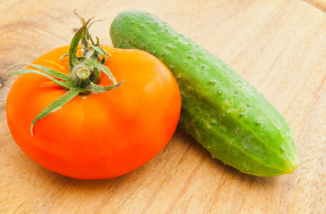 tomato and cucumber on cutting board