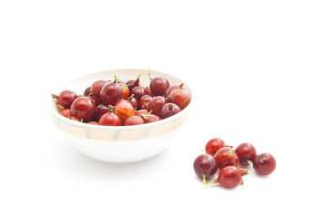 red gooseberries on a glass dish