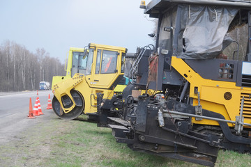 The equipment works at repair of the road