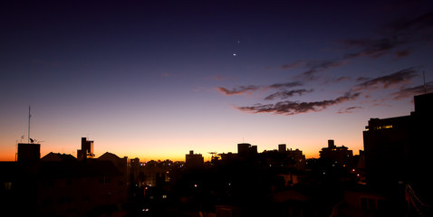 Urban sunset with moon