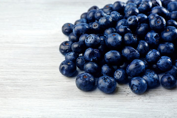 Fresh blueberries on wooden table close up