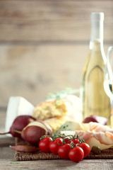 Still life with various types of Italian food and wine