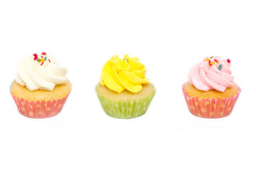 Cupcakes with sprinkles isolated on white background.