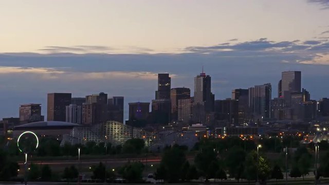 Downtown Denver skyline before dawn. 4K UHD time lapse.