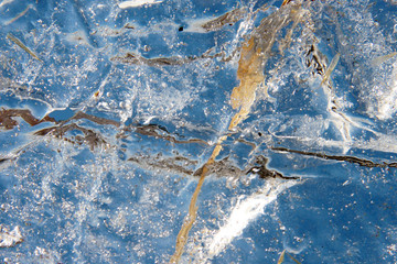 Kind of blue sky through a piece of natural ice