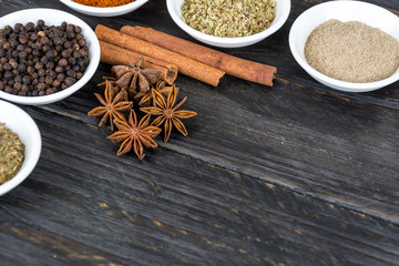 Spices and herbs in  bowls.