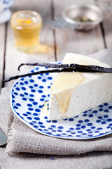 Vanilla and honey cheesecake on a blue plate