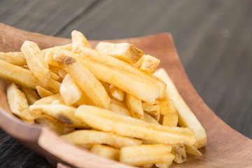 french fries on wood background
