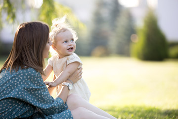 Mom playing with little daughter