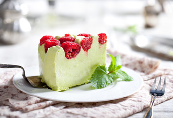 Pistachio mousse cake, cheesecake with raspberry