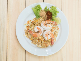 Pad Thai, Thai noodle shrim on wood texture background