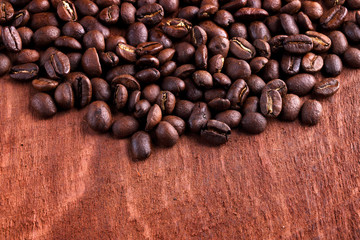 Thai roasted coffee beans on wooden background