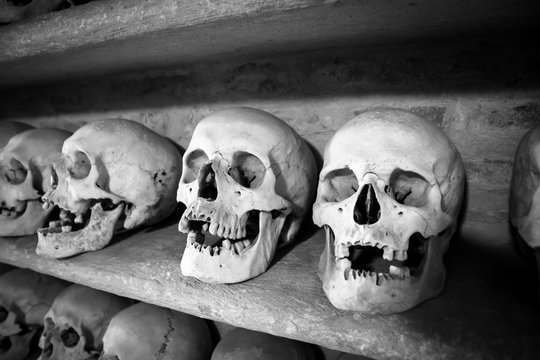 human skulls inside a catacomb