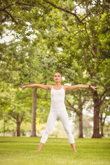 Confident woman exercising in a park