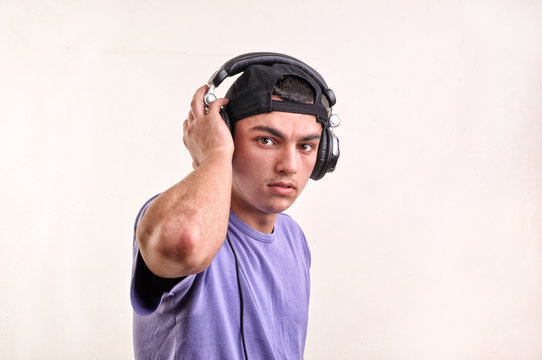 Teenager listening music with headphones