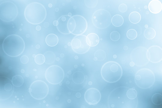 Soft blue bokeh, pastel blue bubble circle on blue background.