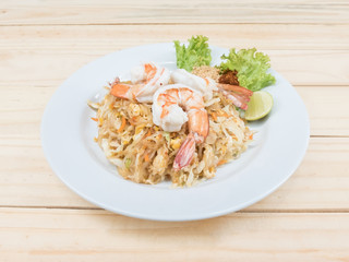 Pad Thai, Thai noodle shrim on wood texture background close up