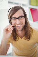 Portrait of happy hipster using microphone
