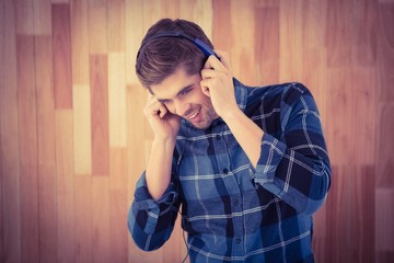 Hipster smiling while wearing headphones