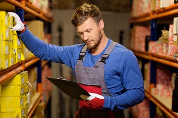 Worker on a automotive spare parts warehouse