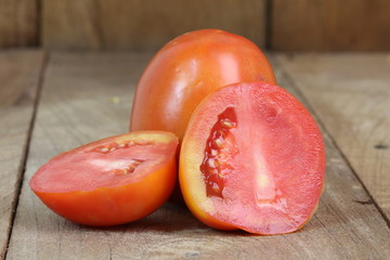 Tomatoes on the wooden floor