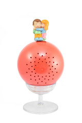 Couple doll on the red ball with a tray.