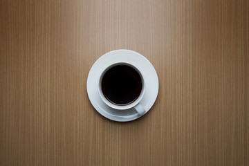 Coffee cup top view on wooden table background