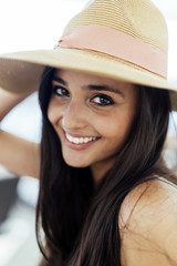 Woman in hat smiling