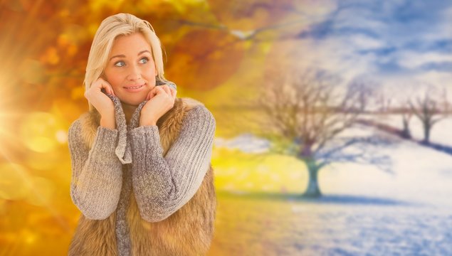 Composite image of blonde in winter clothes smiling 