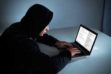 Hacker Stealing Information From Laptop