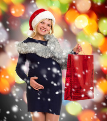 christmas holiday pregnant woman in santa hat